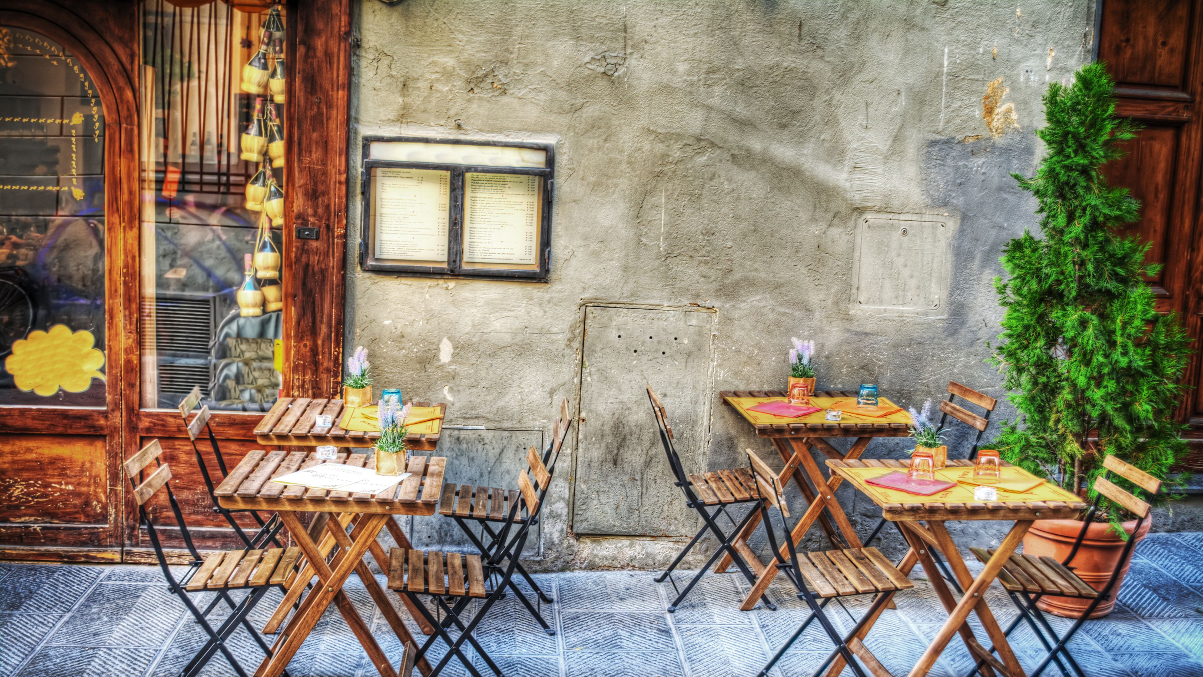 Rustic tables and chairs outside restaurant Florence Rustic tables and chairs outside restaurant Florence
