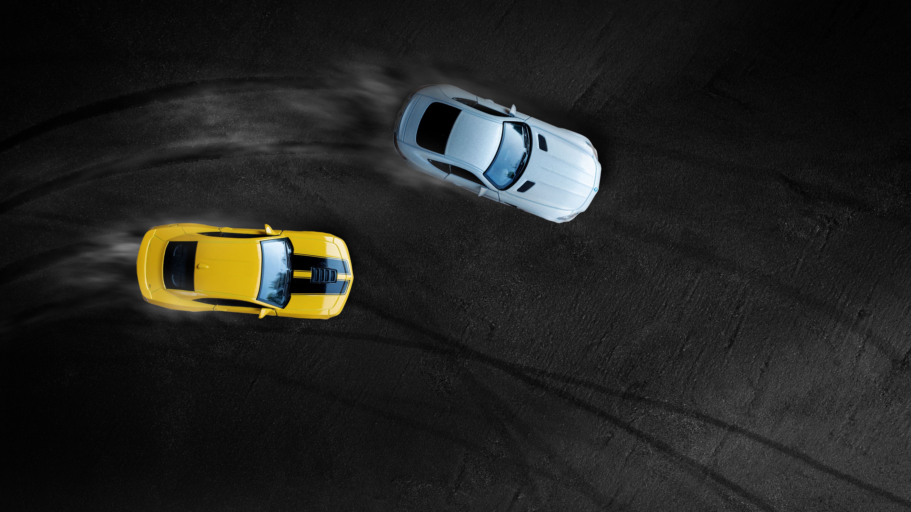 two cars driving in the race track two cars driving in the race track