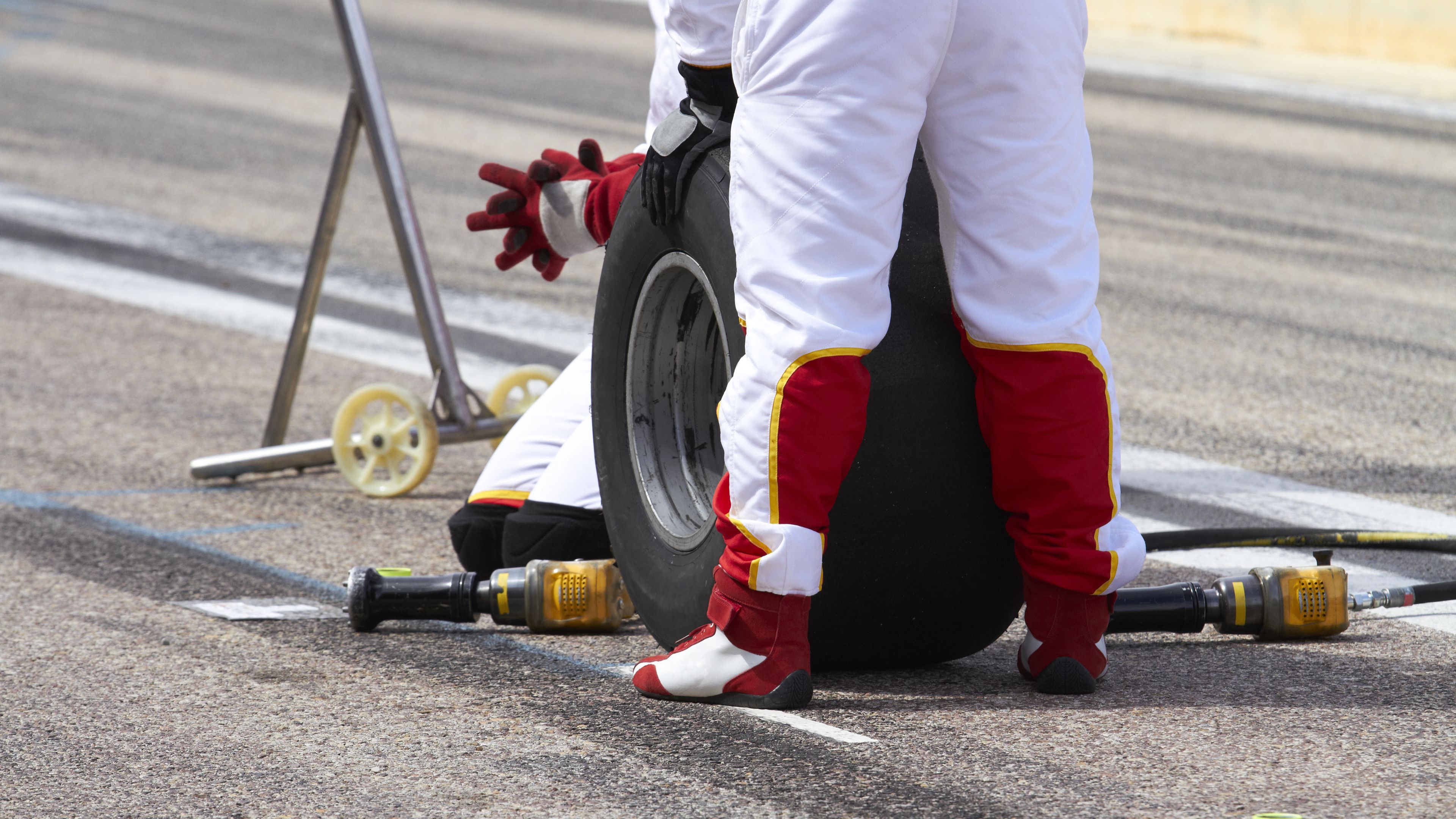 pit crew member with equipment