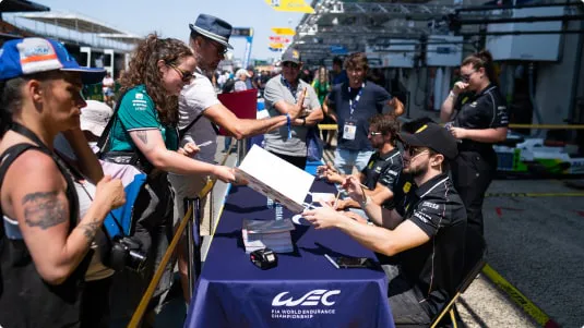 star drivers signing autographs