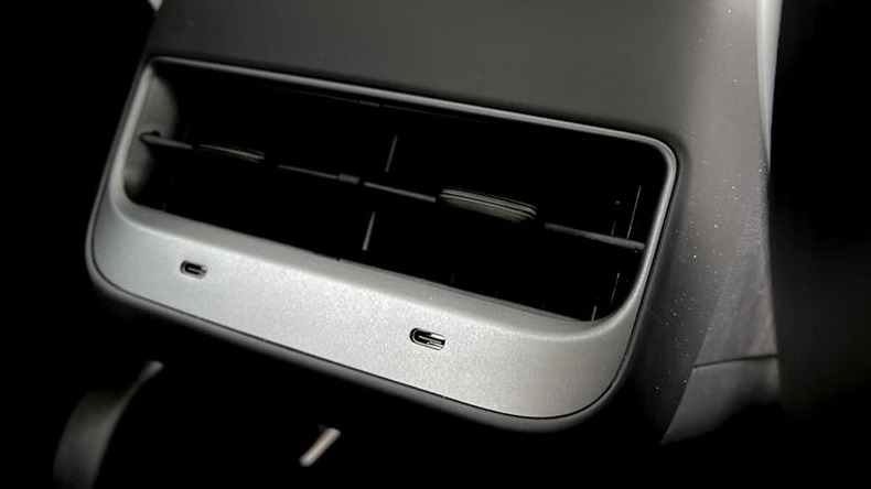 Close-up of USB Type-C connectivity ports in Tesla Car