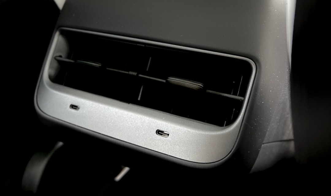 Close-up of USB Type-C connectivity ports in Tesla Model 3